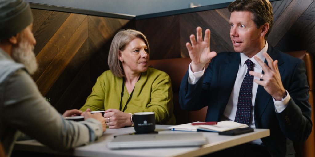 An image of Weatherbys Banking Group staff in a meeting booth