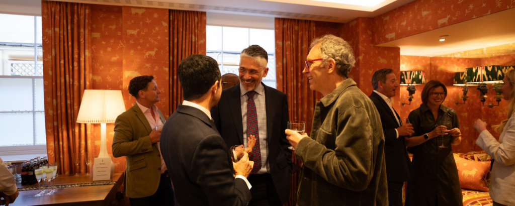 People networking at AI dinner