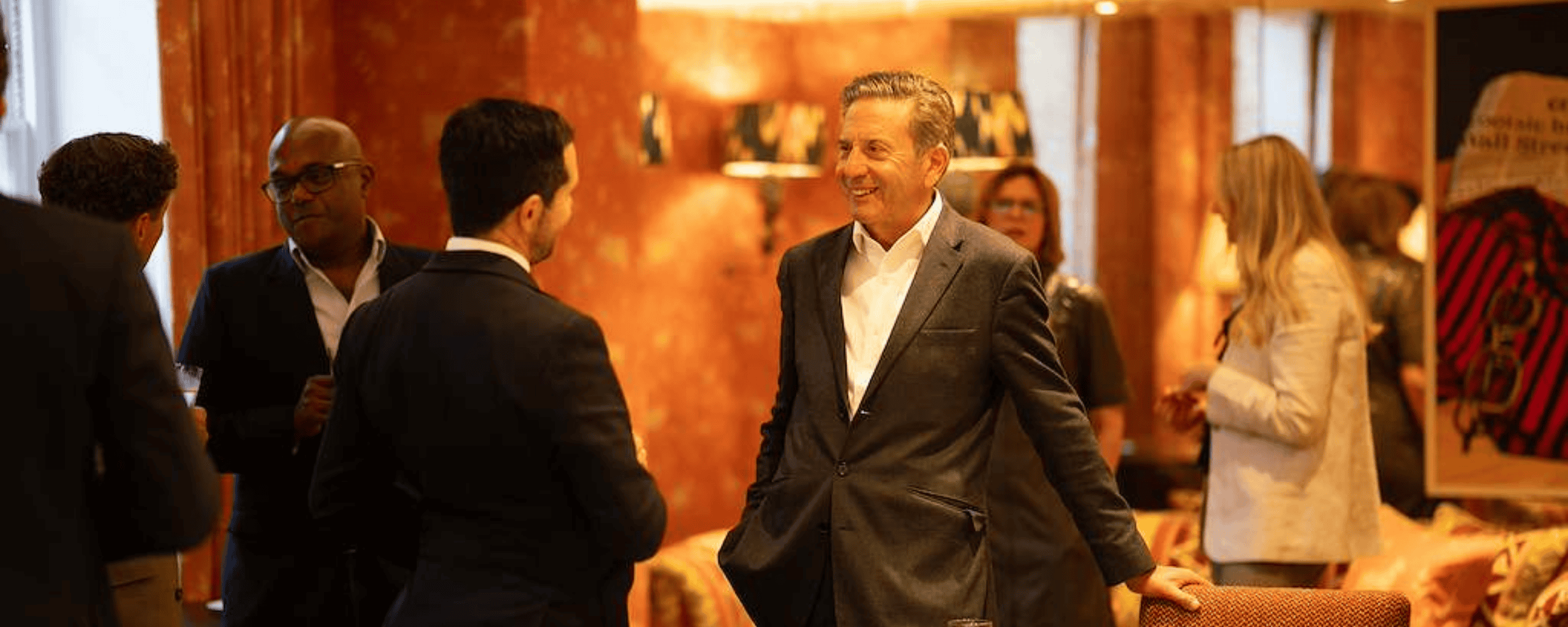 Roger Weatherby smiling at guest at event