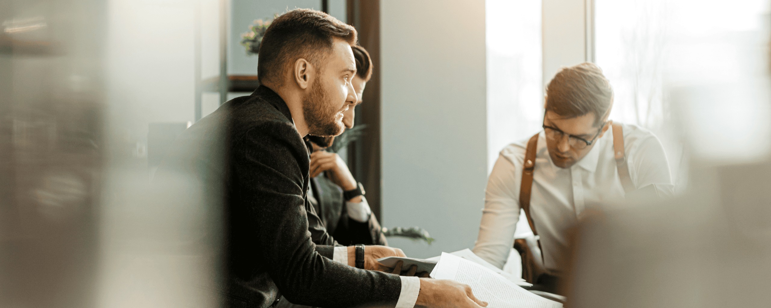 Three business partners coworking in office